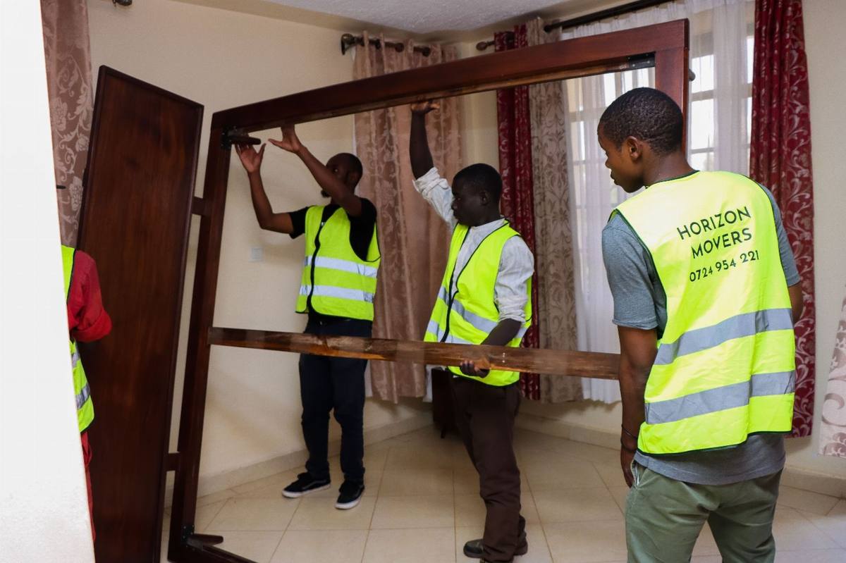 Hi-vis crew packing goods into a container