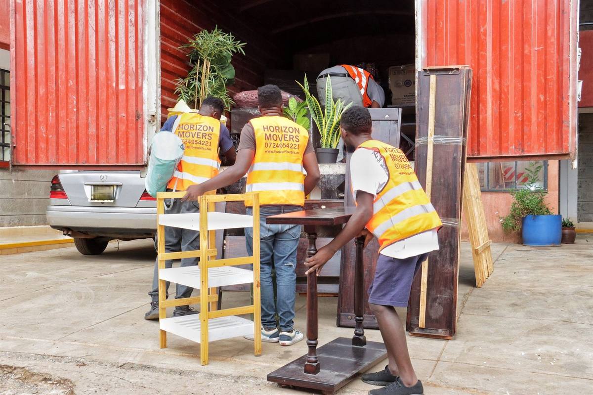 Crew loading a truck for the Nairobi to Kisumu route