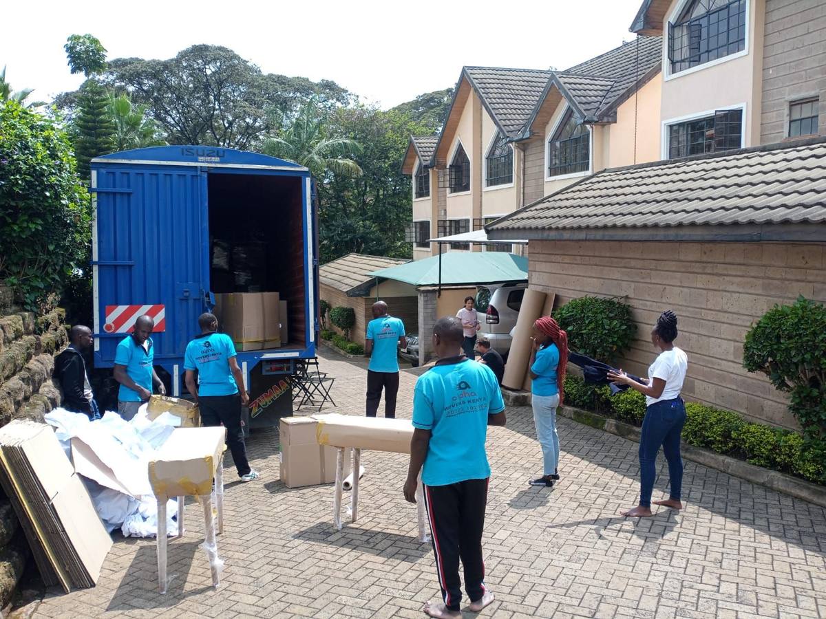 Crew loading a truck outside a townhouse